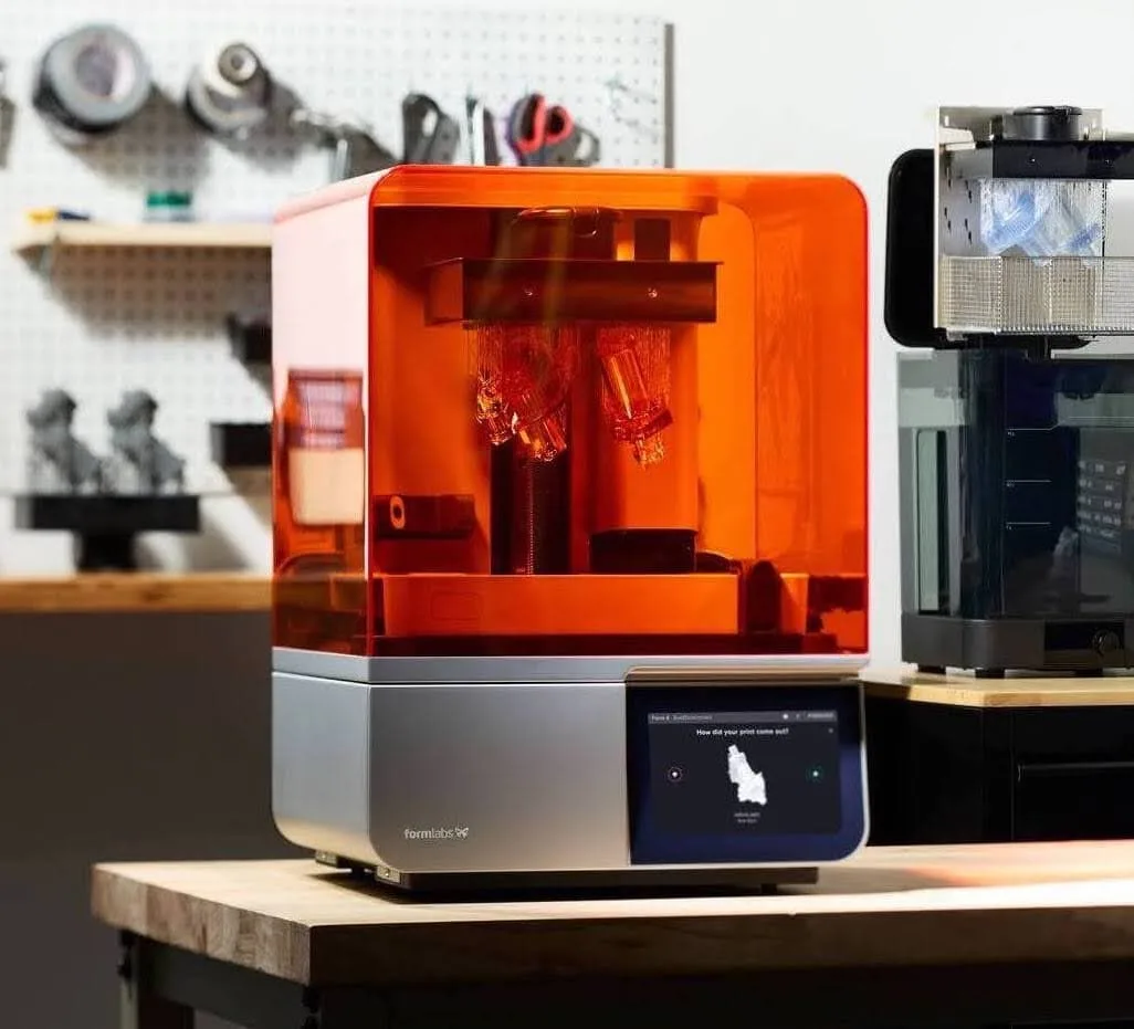 A Formlabs printer in a workspace; contextual imagery for the acquisition.