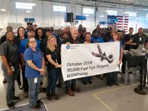 GE employees mark production of the 30,000th additive fuel nozzle tip.